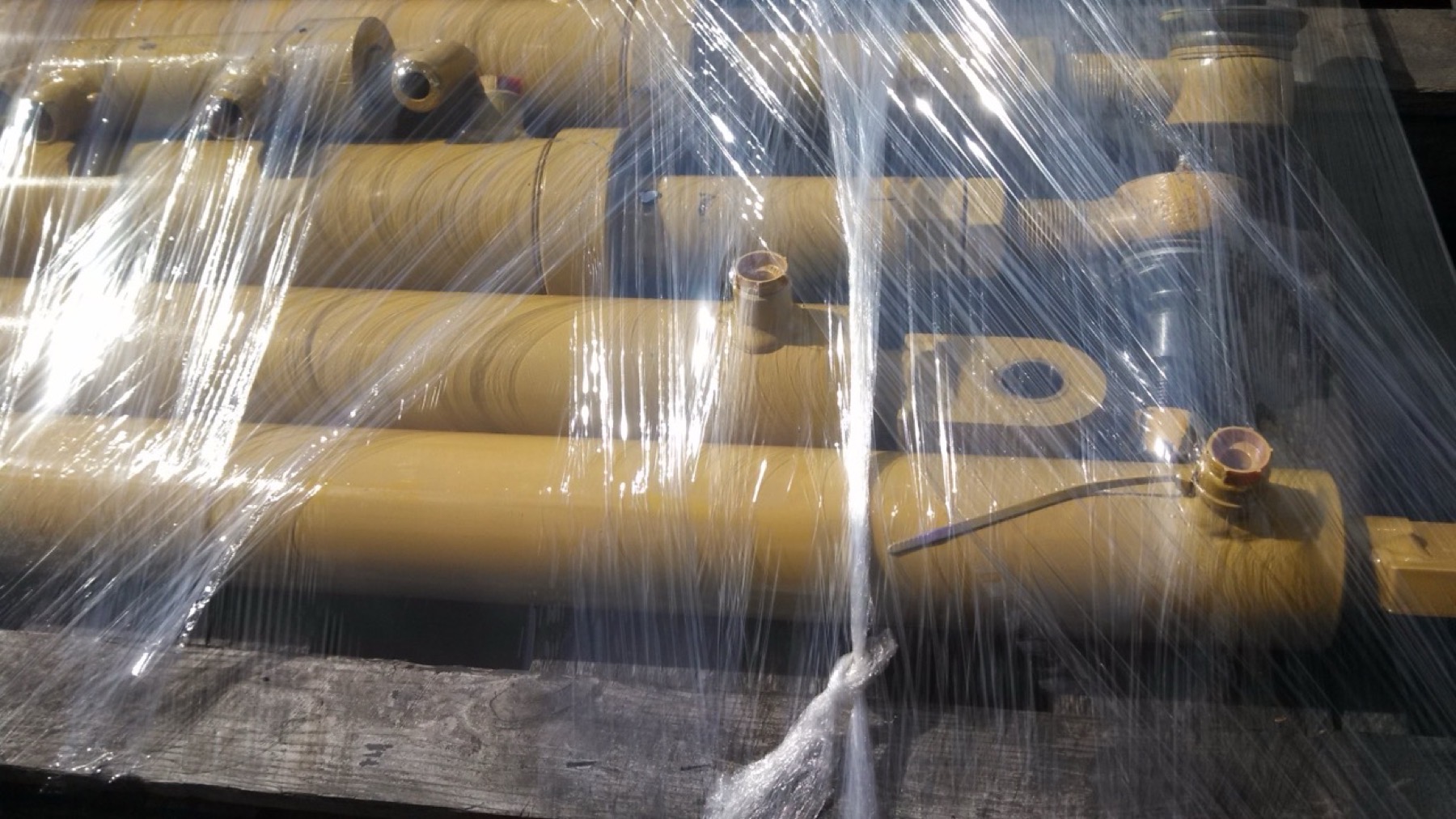 Completed hydraulic cylinders prepared for final handling and shipment