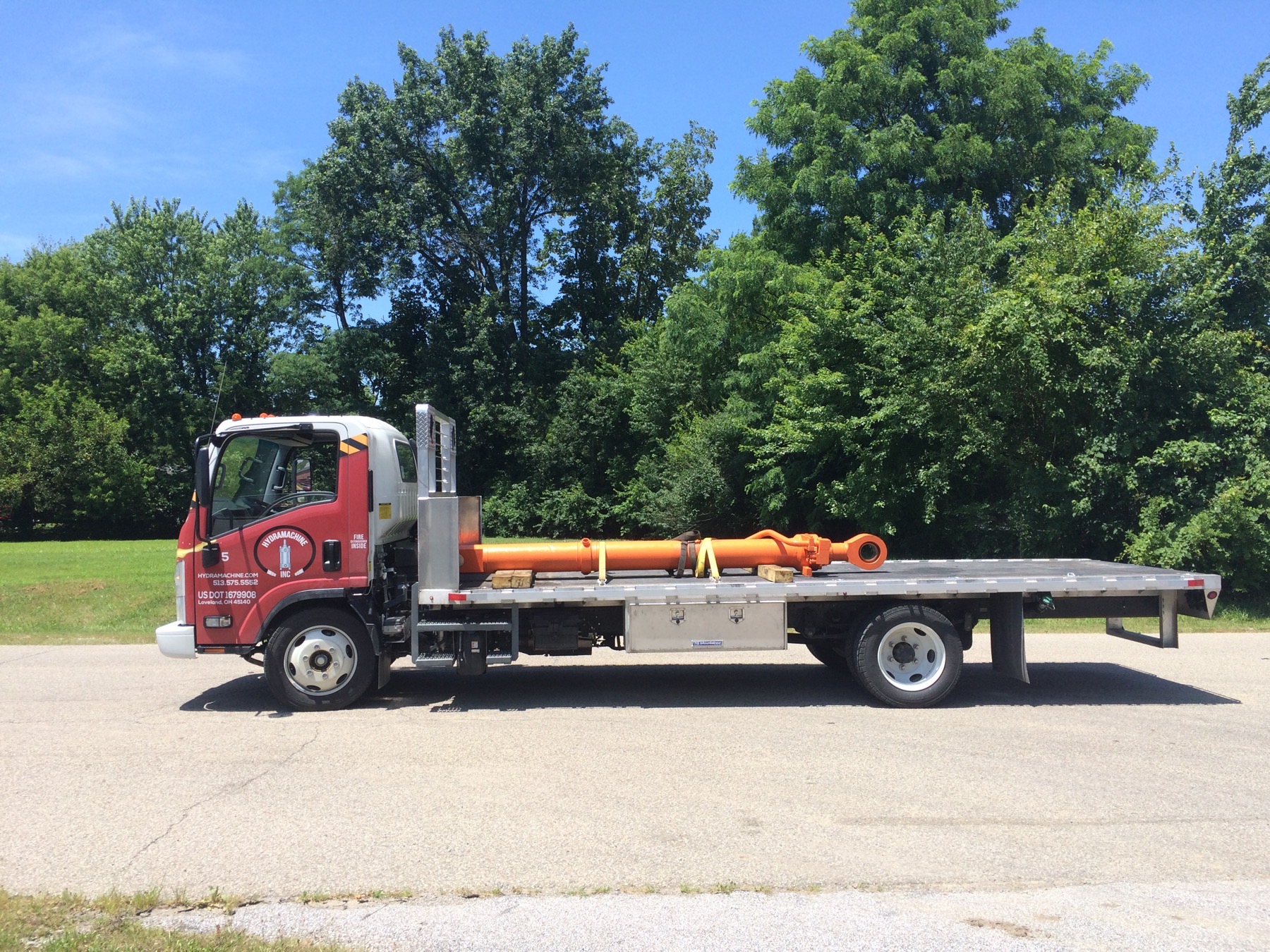Large Hitachi excavator cylinder on truck